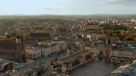 Panorama-of-soft-lighted-Main-Square-in-Krakow,-Old-Town-and-Wawel-Royal-Castle-at-beautiful-morning,-Krakow,-Poland