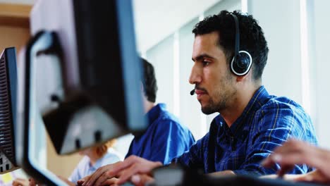 team of business executives working together at desk