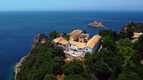 Orbiting-Drone-Shot-of-Paleokastritsa-Monastery-in-Corfu,-Greece