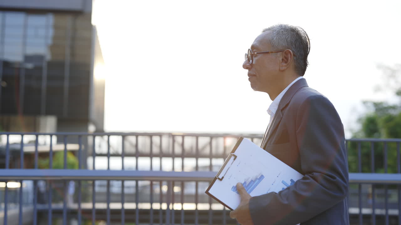 Businessman outdoors with report and coffee