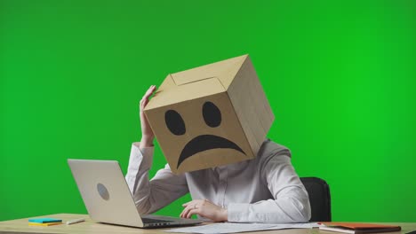 person with cardboard box head