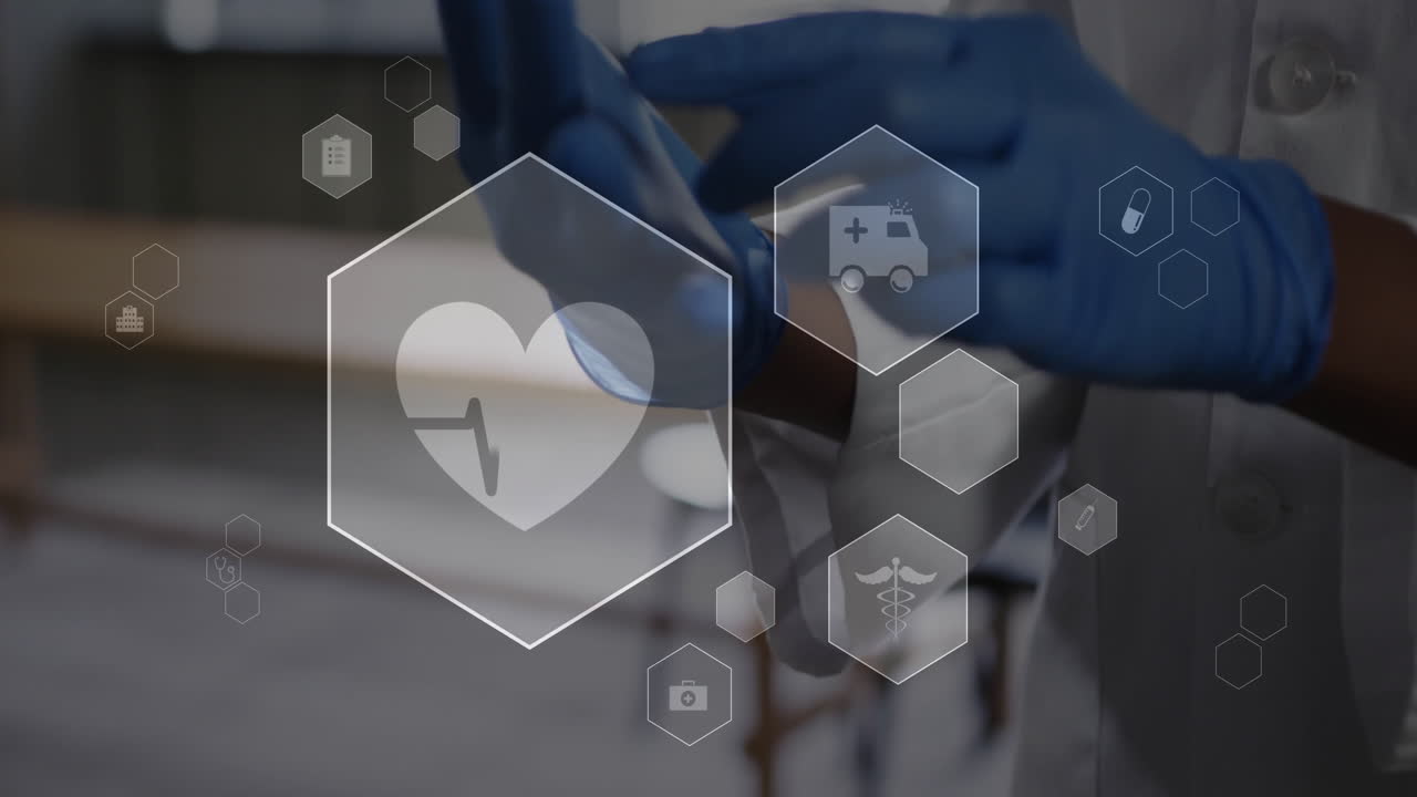 Using tablet, medical professional viewing healthcare technology icons in animation