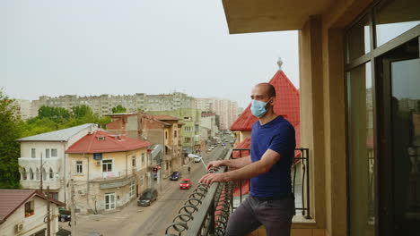 lonely man with mask on terrace