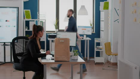 businesswoman holding takeaway food meal order in takeout lunchtime in business corporate