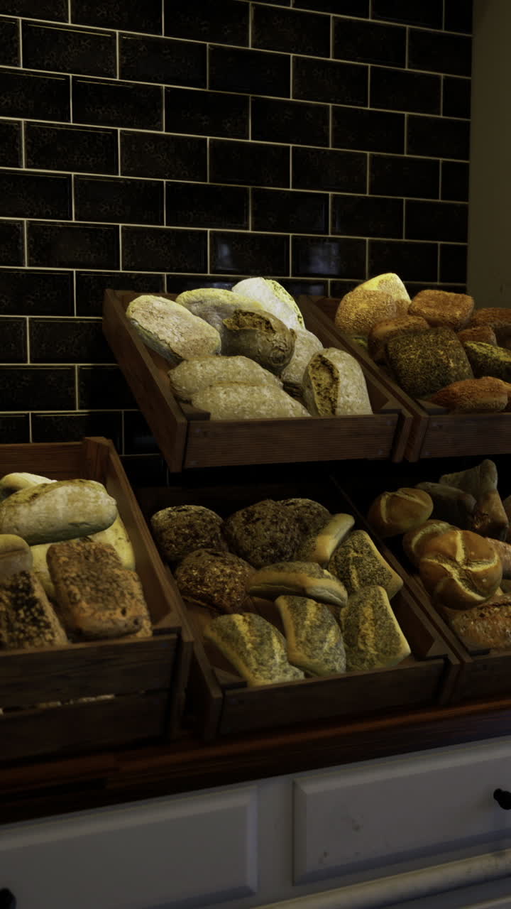Freshly baked bread displayed in rustic wooden crates inside a bakery