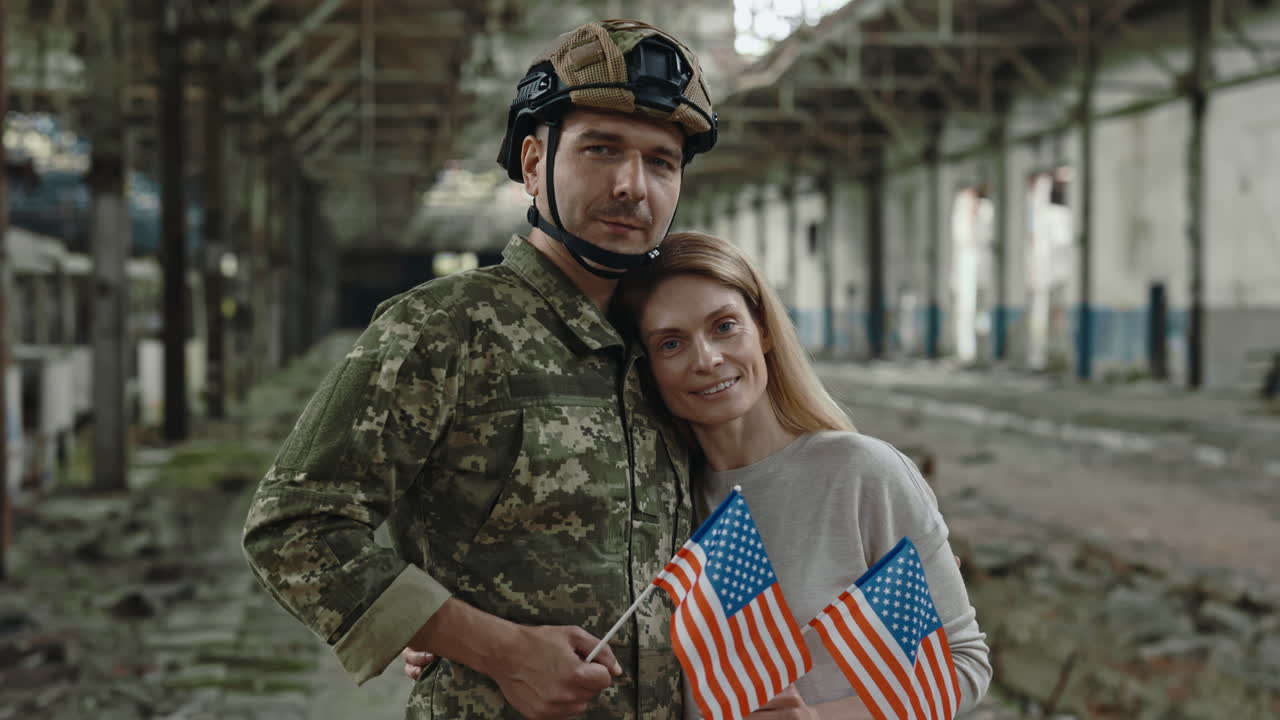 Military Couple with American Flags in a Destroyed Building