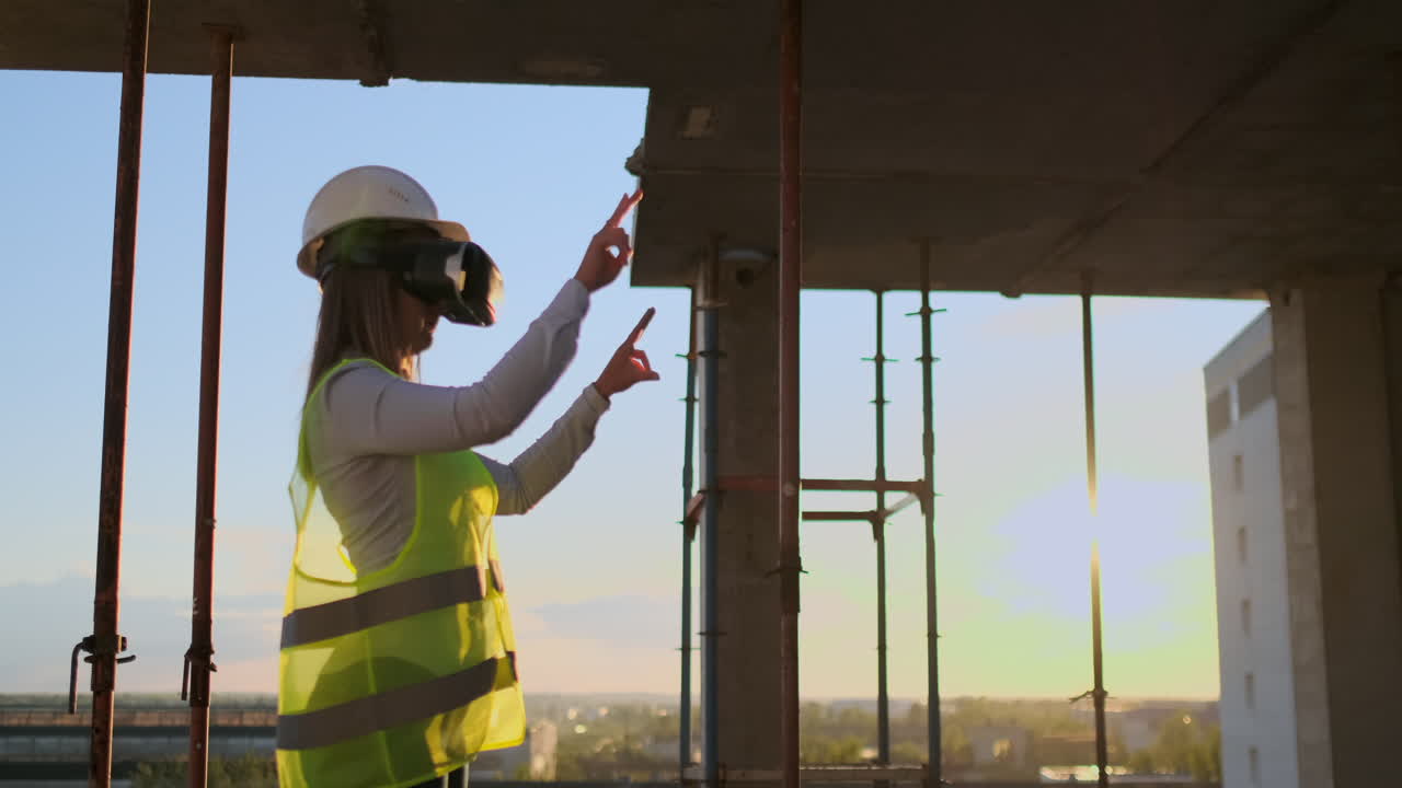 ingeniera femenina con auriculares vr dirigiendo un proyecto de construcción.