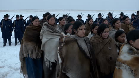 native american women and soldiers in winter