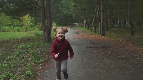 girl running in an autumn park