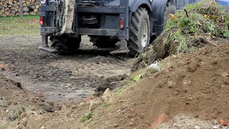 digger excavating earth from building site in czech republic