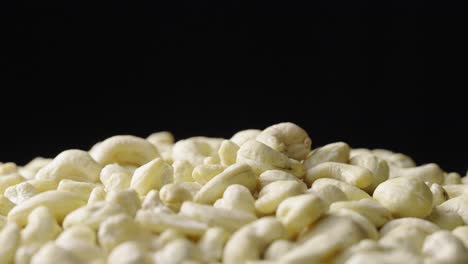 cashew nuts on black background