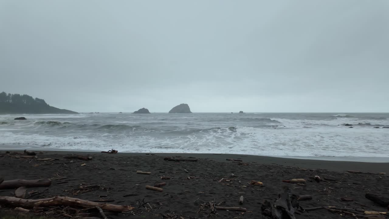 Gimbal wide panning shot of strong ocean surf along the coast near Crescent City, California. 4K