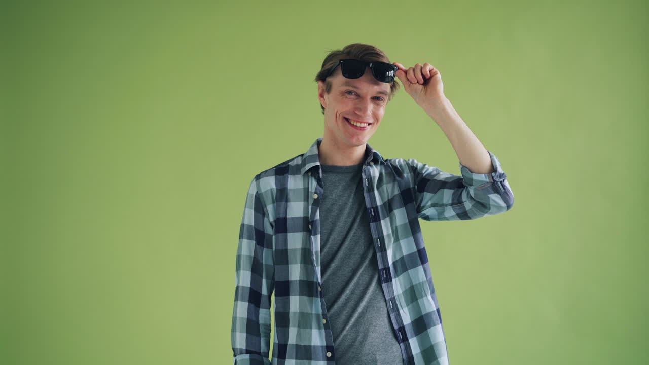 Man in Plaid Shirt with Sunglasses