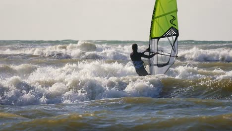 windsurfer on high waves. baltic sea, poland