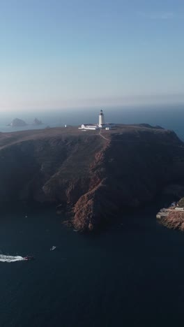 aerial view of a lighthouse on a coastal cliff