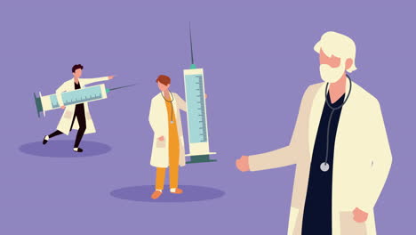 personal médico con jeringuas de vacunación