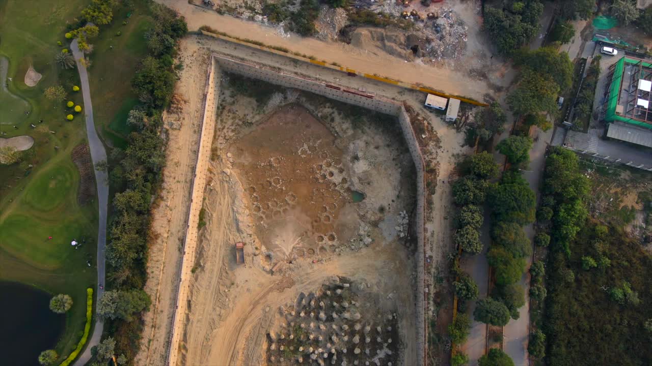 Top down Aerial drone shot capturing a massive construction site in Noida India