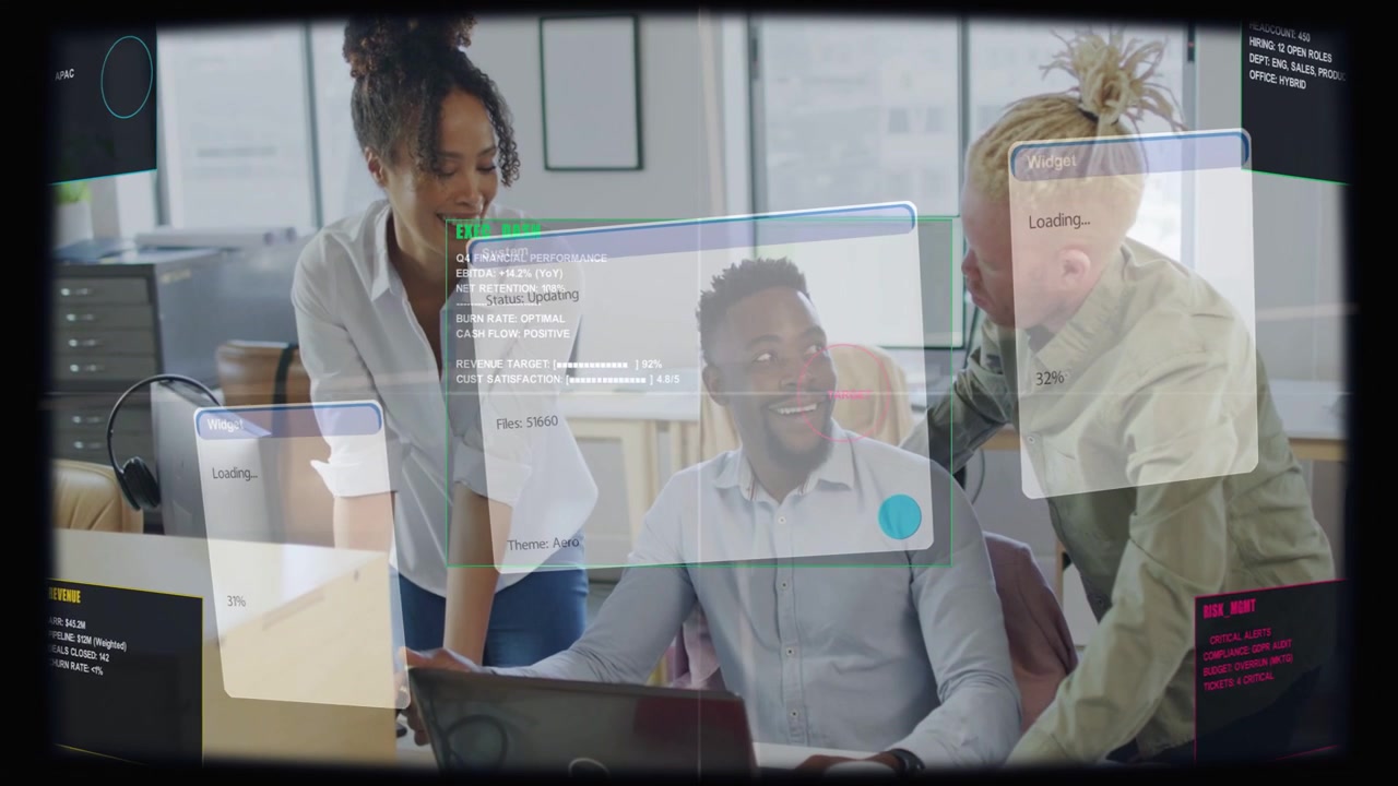 Seated man typing while colleagues pointing at laptop, reviewing software demo overlays loading