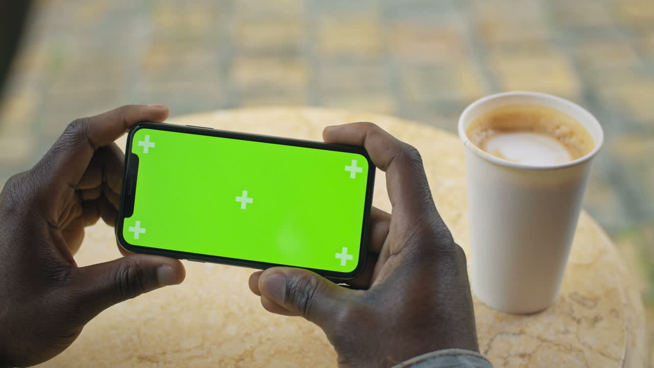 Smartphone with Green Screen and Coffee
