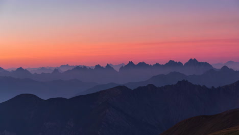 layered mountain silhouettes at sunset