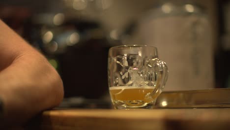 glass of beer on bar in pub