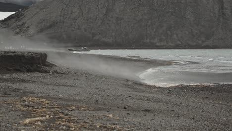 steam is rising over beach from water fast, close to volcano