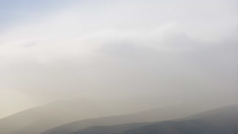 Mountains-Time-lapse-of-fog-and-clouds-passing-over-Vitosha-mountain,-Bulgaria-until-the-sun-sets