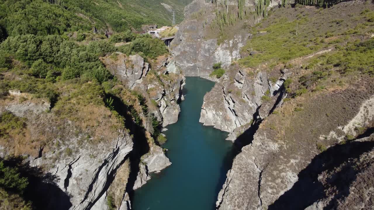 Drone view of a river flowing donw Kawaru Gorge, Queenstown, New Zealand.