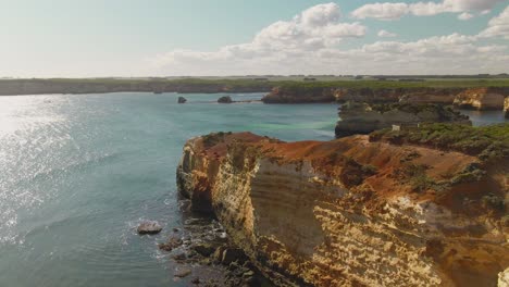 4k aerial high rocky cliff on the ocean drone truck right to left shot