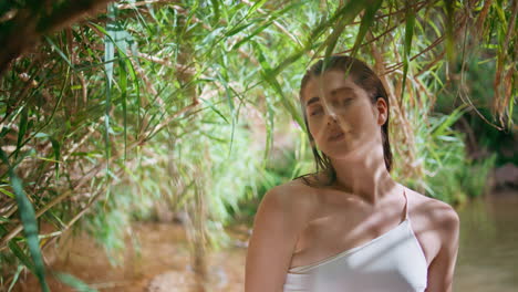 portrait model resting tropics nature in summer sunlight. woman posing jungles