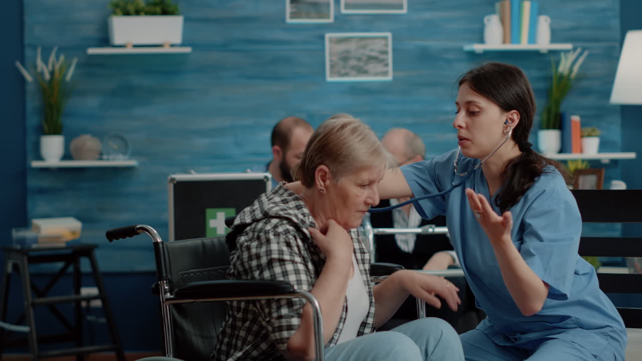 Medical assistant using stethoscope on senior patient
