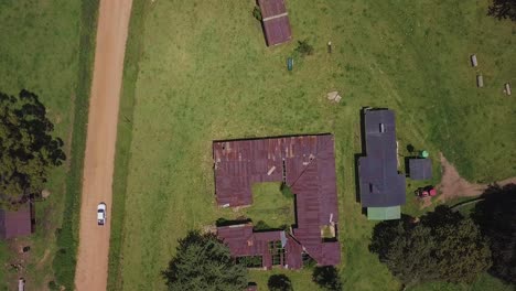 Elevate-your-perspective-with-a-stunning-bird's-eye-view-of-a-bakkie-traversing-a-scenic-gravel-road