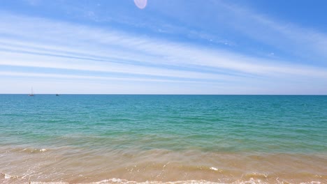 thailand beach in sunny blue sky summer holiday season. traveling to the southern sea. white rays altostratus clouds calm waves surfing on the sandy shore. clear day skyscape texture nature background