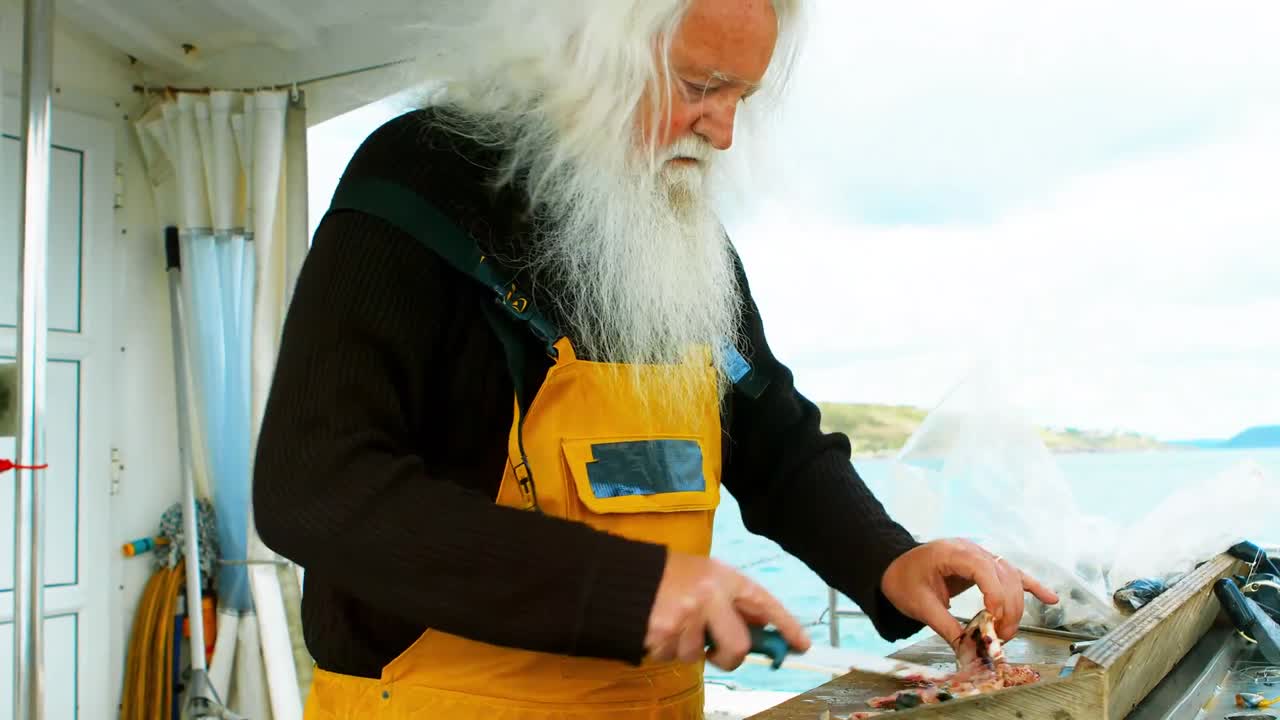 Fisherman filleting fish