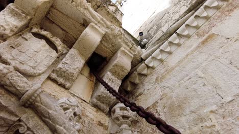 rusted gate chain of the medieval fortress of belem tower in lisbon, portugal