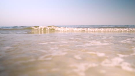 Close-up-view-of-calm-ocean-waves-at-sunny-day