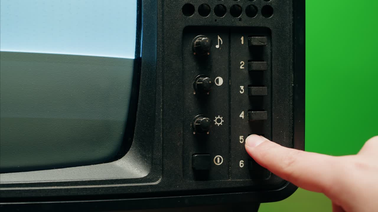 Retro Style TV Set with Green Screen chroma key background, vintage 60s analog television with grain and noise.