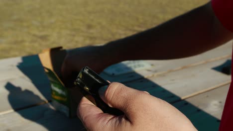 close-up of hand loading bullets in a gun magazin