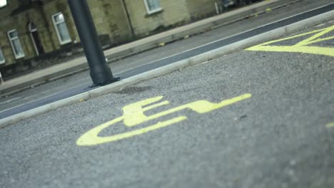 disabled parking signs in asphalt car park