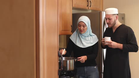 middle eastern young couple make make soup she stirs track left