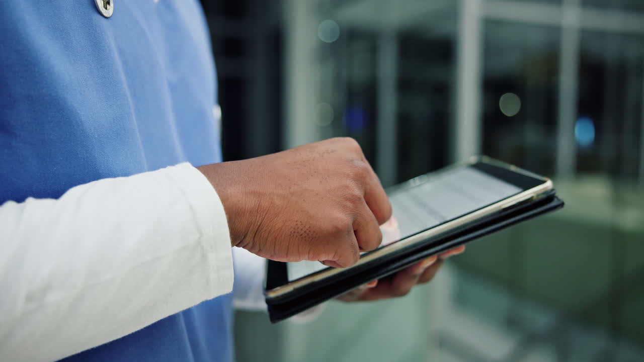 Medical professional using a tablet