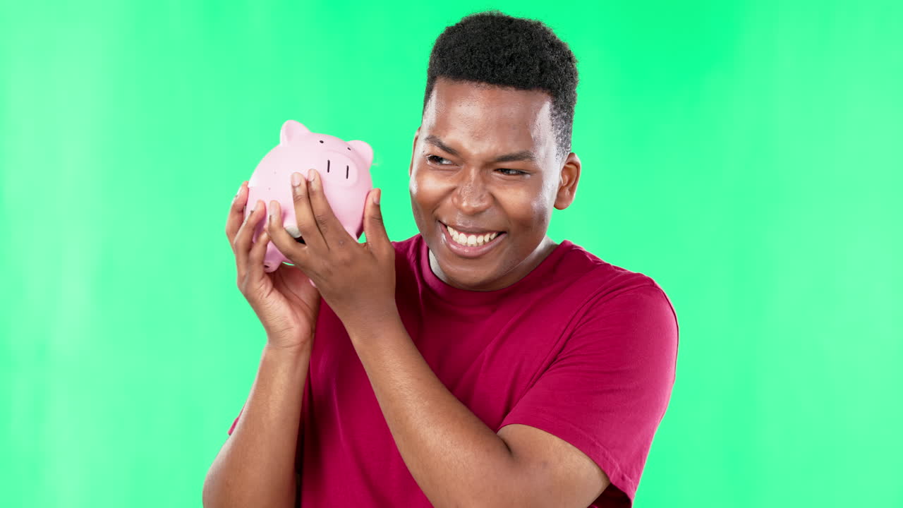 Happy man, face and piggy bank on green screen