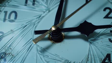a close-up of a broken clock reveals cracks on the face and dirt accumulation near the center. the hands are frozen in place, highlighting an abandoned moment in time.