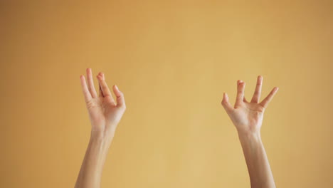 Hands Gestures on Orange Background