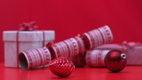 christmas decorations spinning beside crackers and presents