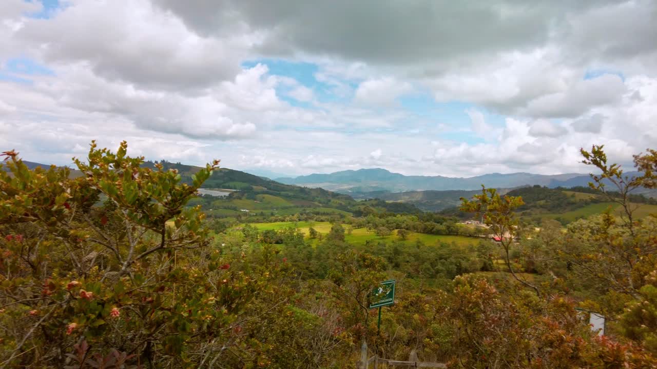 Panoramic view of the mountains of the Colombian altiplano at the Guatavita lagoon on a cloudy day with