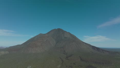 aerial approach to mexico's tres virgenes volcano, copy space in sky