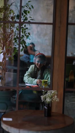 woman working from a cafe