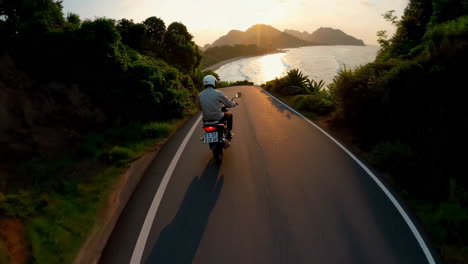motorcycle ride on a scenic coastal road at sunset