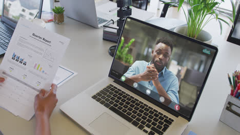 African-american-businesswoman-using-laptop-for-video-call-with-african-american-business-colleague